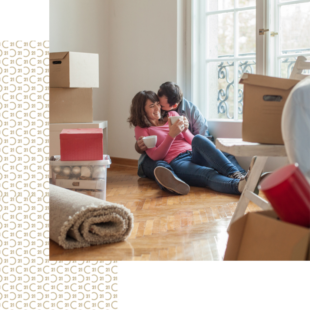 A happy couple moving into a new home.